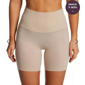 TC Girl Power Waistline Bike Pant in tan. Size Large NWT